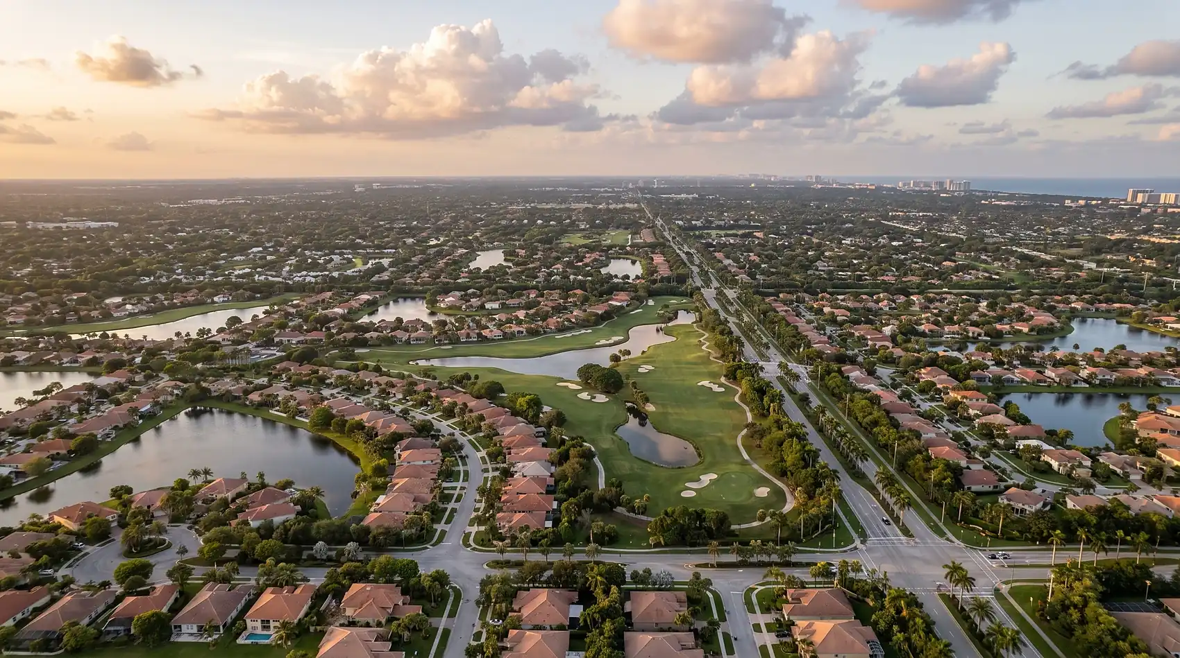 High aerial over western Broward County neighborhoods at golden hour