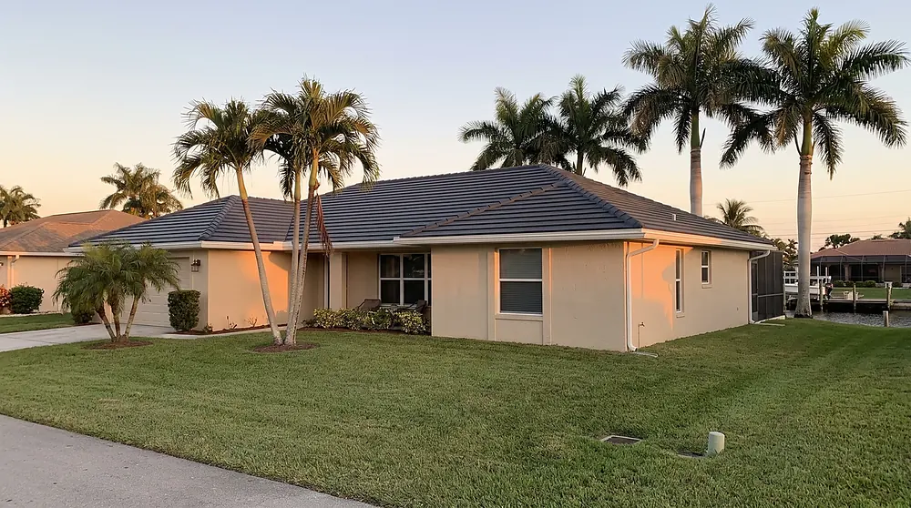 Completed flat tile roof on a South Florida home at golden hour