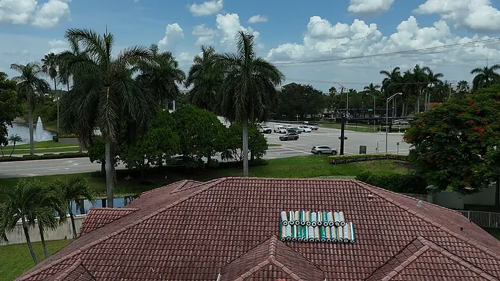 Barrel tile roof under a South Florida sky